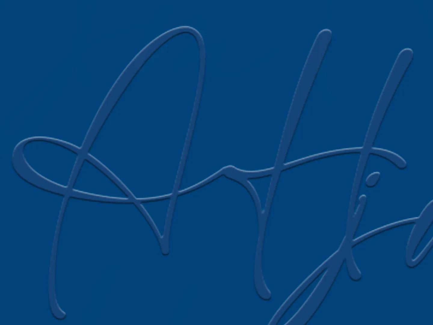 Detail of the front: the handwritten initials AHJM in relief, blue on blue.
