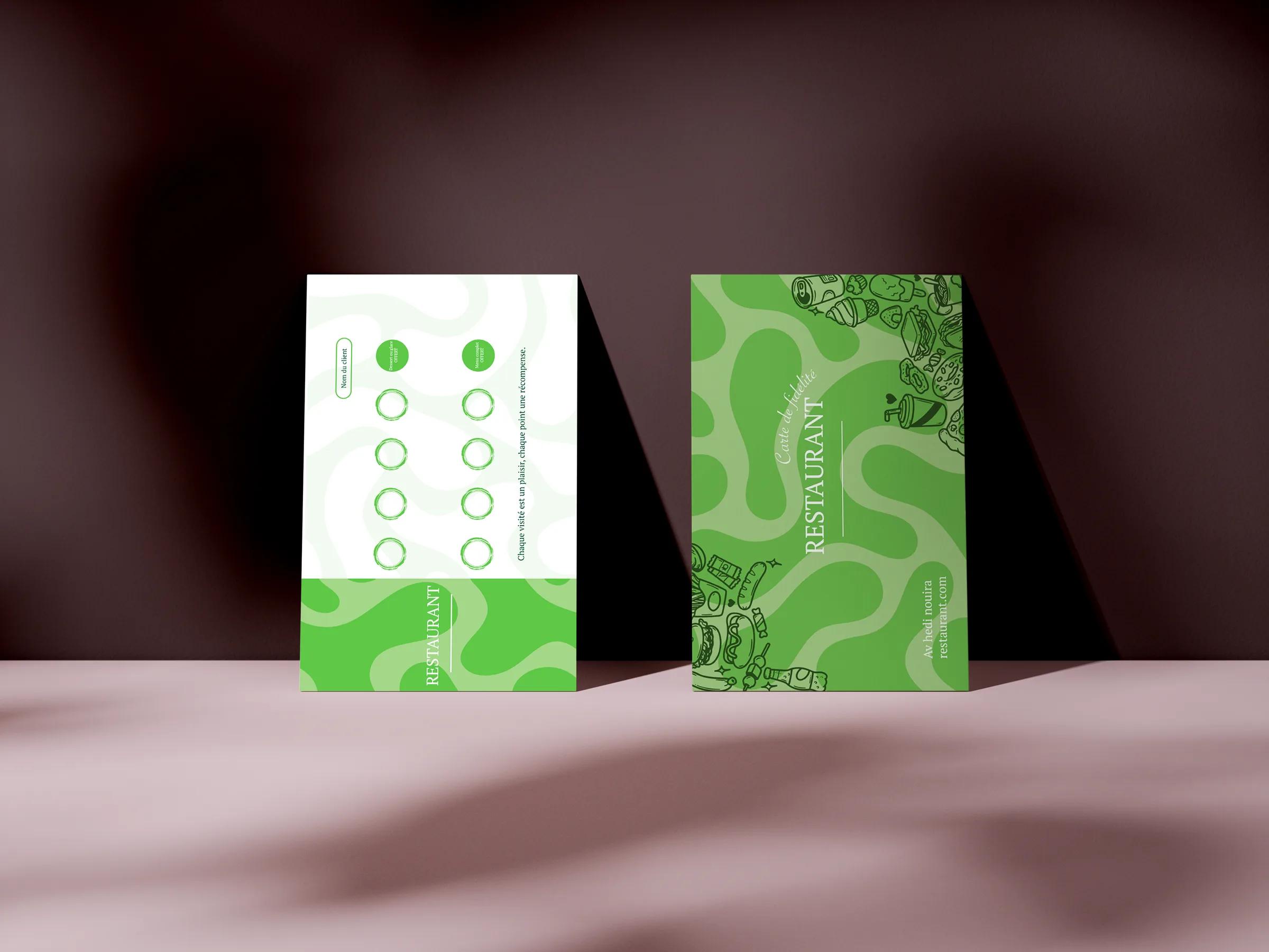 Both faces of the loyalty card, standing against a dark wall.